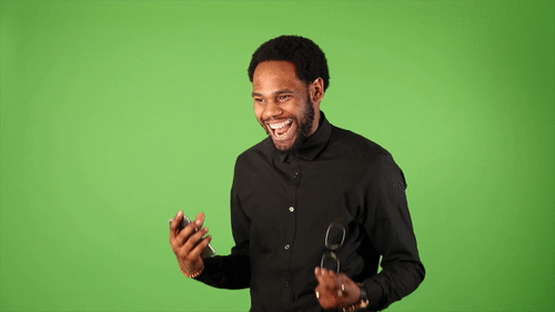 A man who is excited about something, using his hands to express this.